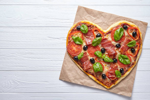 istock Pizza heart shaped love design concept Valentine's Day symbol romantic dinner 646853432