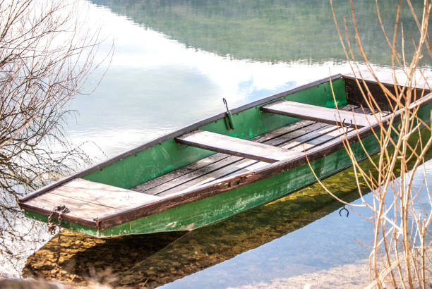 istock Green Boat on the Lake 646853574