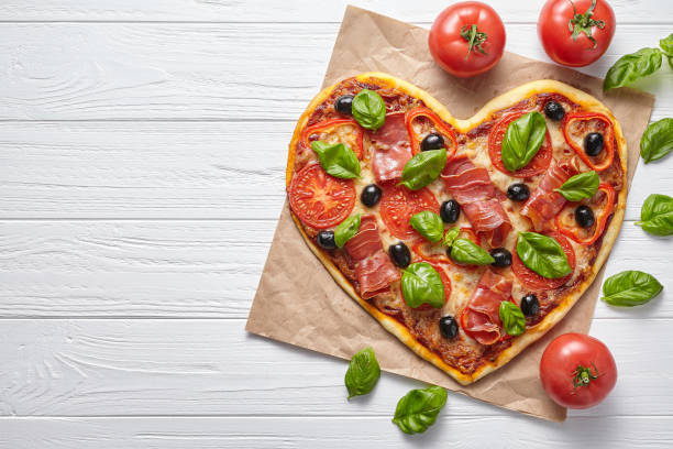 istock Heart shaped pizza love concept Valentine's Day design symbol romantic restaurant 646853642
