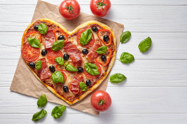 istock Heart shaped pizza hot love concept Valentine's Day design symbol 646855772