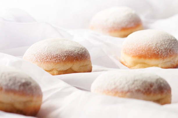 istock Jelly filled doughnuts with powdered sugar on a bed 646856262