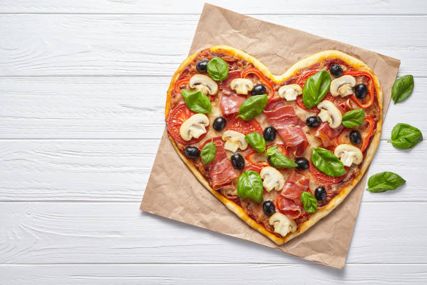 istock Heart shaped pizza delicious love concept Valentine's Day 646856324