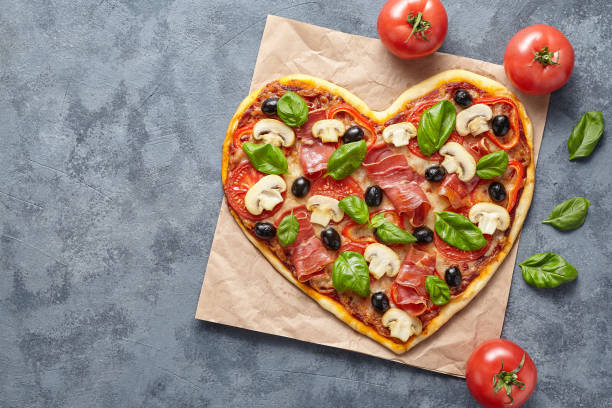 istock Heart shaped pizza love concept Valentine's Day flat lay 646856420