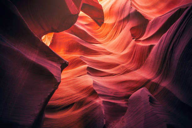 Colorful walls of Antelope Canyon A view of the rock walls of the Lower Antelope Canyon outside Page, Arizona. lower antelope canyon stock pictures, royalty-free photos & images