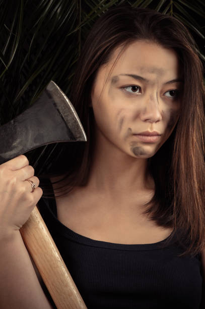 istock beautiful Korean girl with ax in hands 646868612