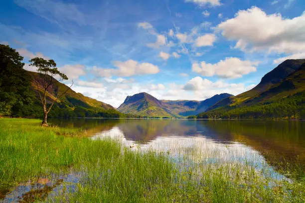 The sun shines down on Buttermere in the English Lake District.