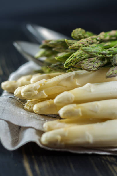 istock Spring season - fresh white and green uncooked asparagus 646872612
