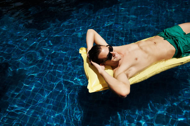 istock Whiling away the hours in the pool 646875892