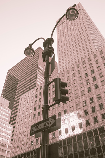 one-way traffic light with skyscrapers in New York City