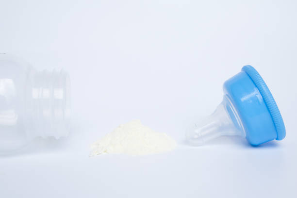 istock powdered milk and baby bottle 646876926