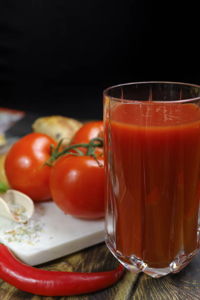 istock Raw Organic red Tomato Juice with salt, basil and bread 646880686