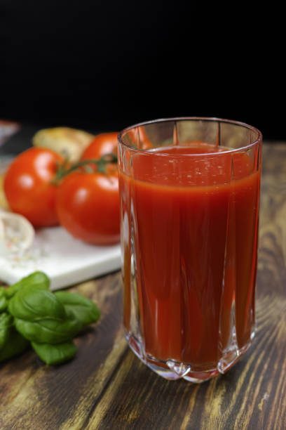 istock Raw Organic red Tomato Juice with salt, basil and bread 646880774