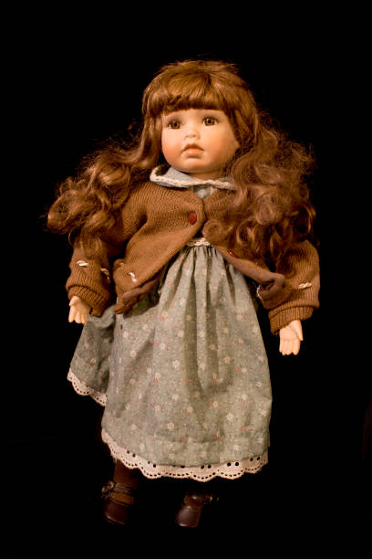 istock Toy Dolly on Black Background 646883544