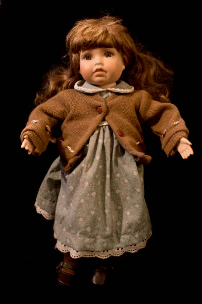istock Toy Dolly on Black Background 646884056