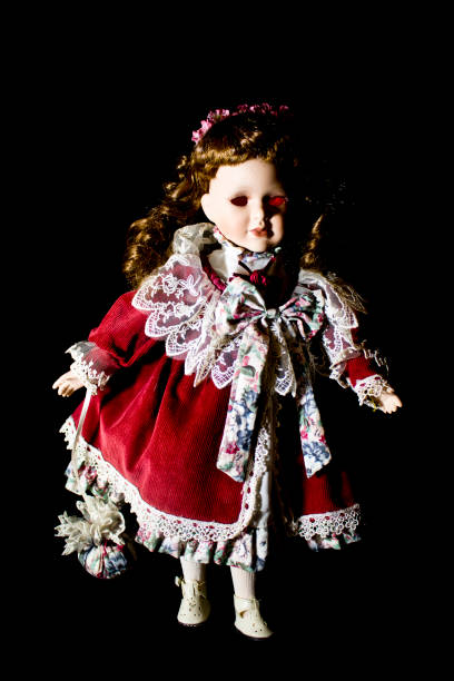 istock Toy Dolly on Black Background 646884400