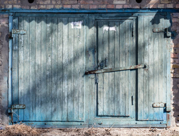 istock old metal warehouse door 646885062