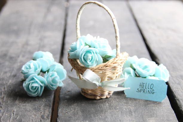 istock hello spring tag and flowers in a small basket 646885148