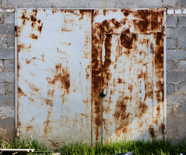 istock old metal warehouse door 646888442