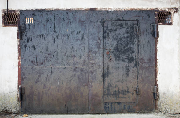 istock old metal warehouse door 646888712