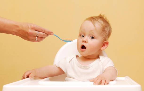 istock Baby Boy In High Chair 646893568