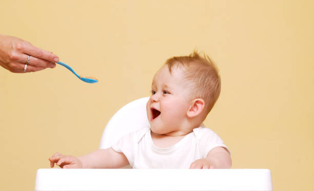 istock Baby Boy In High Chair 646893892