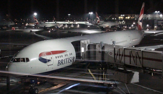 Scenery Of Lots Of British Airways Passenger Airplanes Parked At Loading And Unloading Gate Of Heathrow Airport In The Night In London United Kingdom Europe