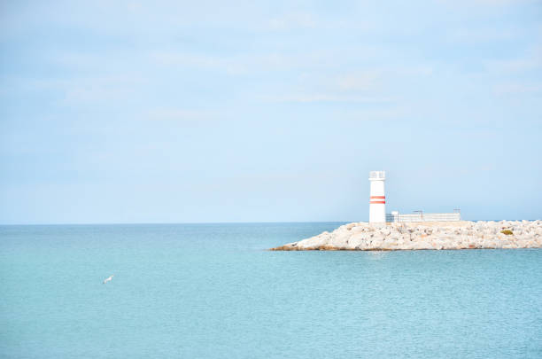 istock Small light house on a sunny day 646906240