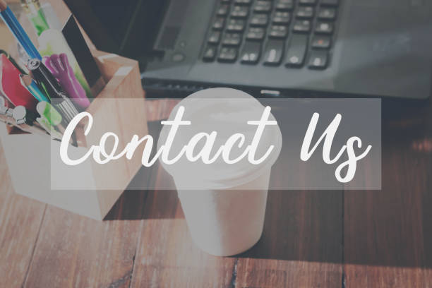 istock Contact Us message on the device works the table background correspondence Customer Support Concept 646908340