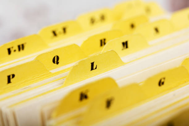 istock Close up of alphabetical index cards in box 646910912