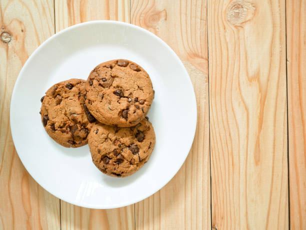 istock Chocolate chip cookies on wooden background 646911426