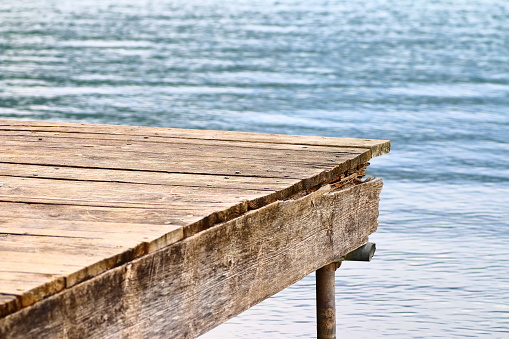 Wooden boardwalk with blue sea