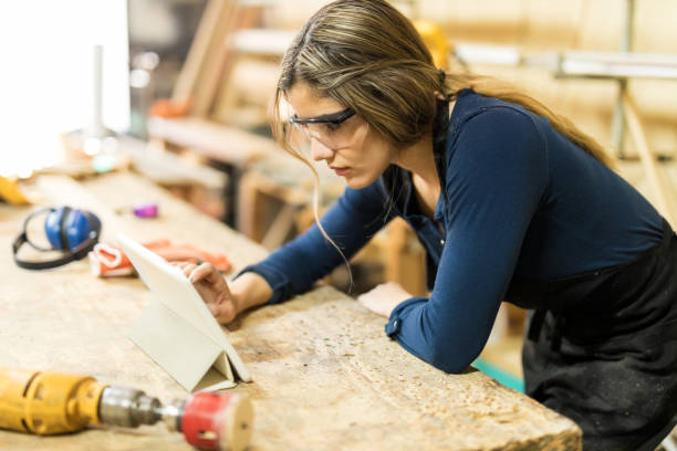 istock Woman using tablet in a woodshop 646922340