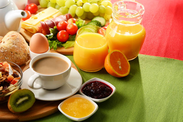 istock Breakfast served with coffee, orange juice, egg and fruits 646926422