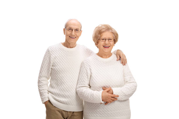 istock Happy senior couple smiling and looking at the camera 646928072