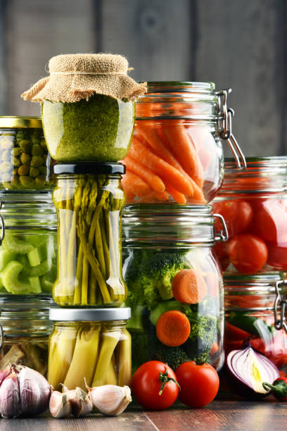istock Jars with marinated food and organic raw vegetables 646930270