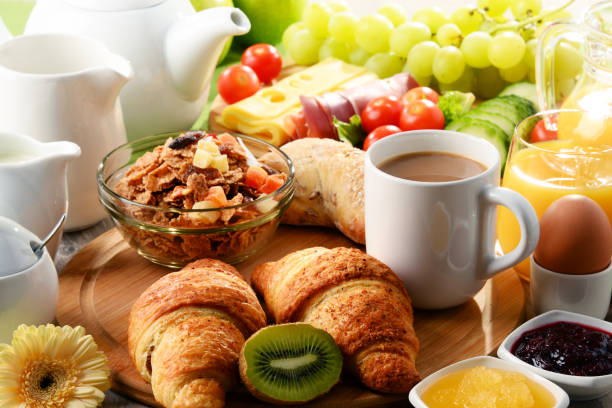 istock Breakfast served with coffee, orange juice, egg and fruits 646931226