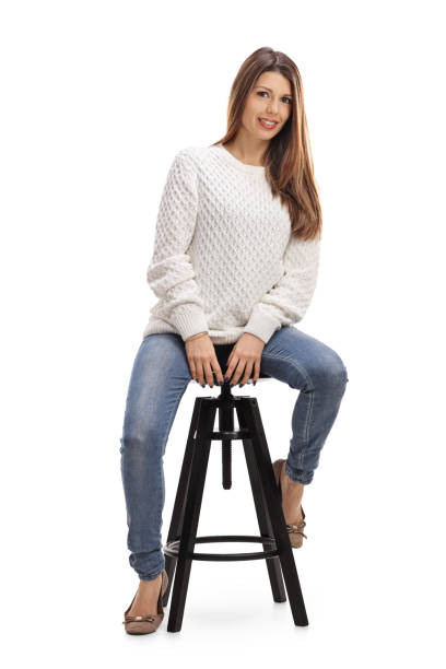 istock Young attractive woman sitting on a chair 646931234