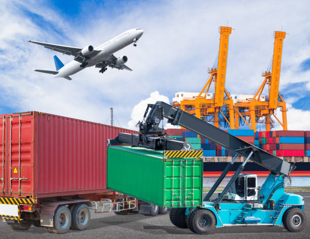 istock Truck transport container with crane lifting at ship port 646931728