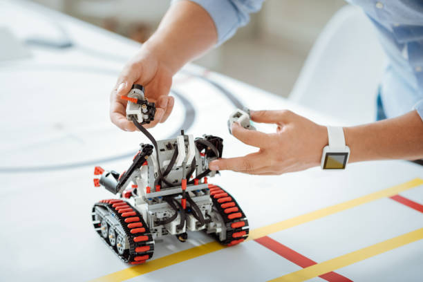 istock Close up of artificial robot standing at the table 646935370