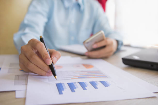 istock Businessman check business profits with on project at office. 646938470
