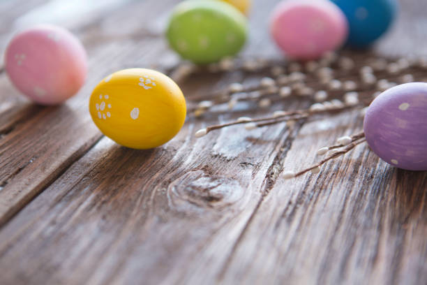 istock Easter eggs painted in different colors near willow twigs 646942858