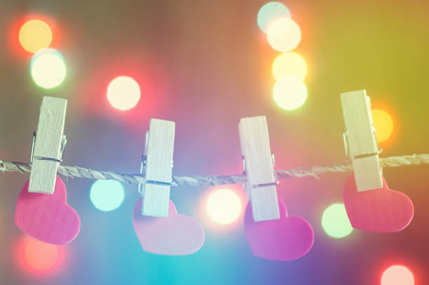 heart holding on rope with blur bokeh background