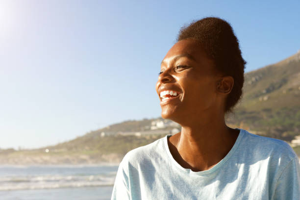 istock Attractive african woman standing outdoors and laughing 646950402