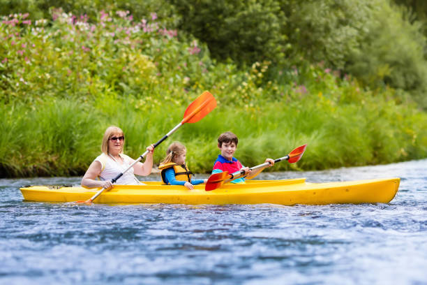 istock Family enjoying kayak ride on a river 646950864