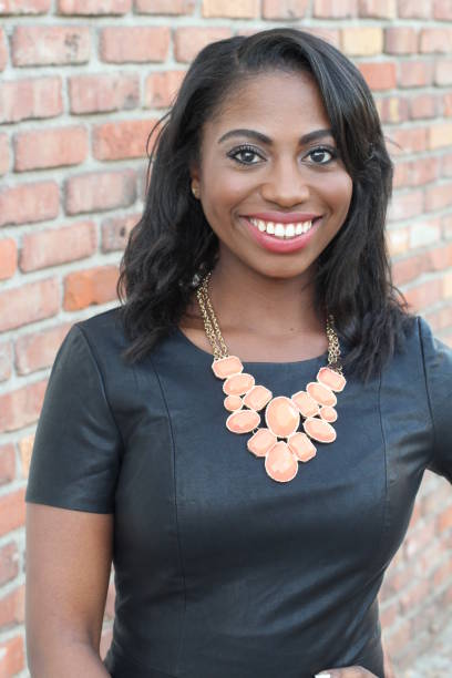 istock Happy elegant African woman smiling 646954604