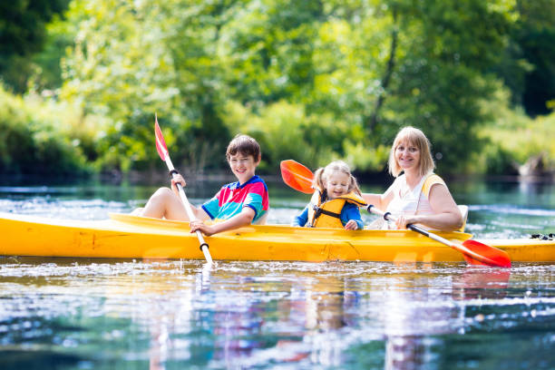 istock Family enjoying kayak ride on a river 646957288