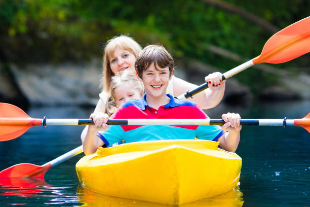 istock Family enjoying kayak ride on a river 646957366