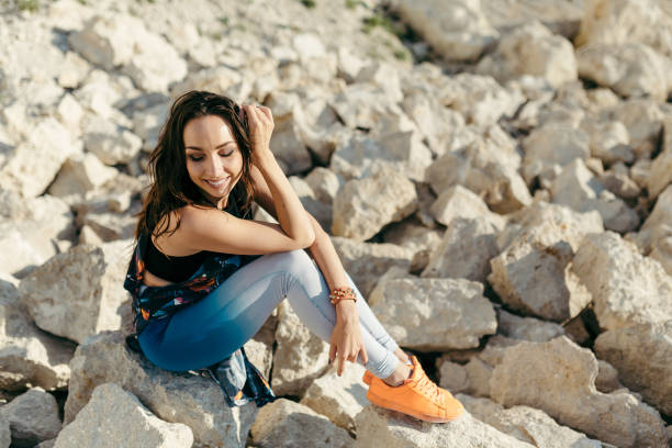 istock Young woman dressed colorful clothes posing 646959248