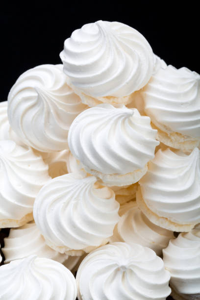 istock French vanilla meringue cookies on white background 646965324