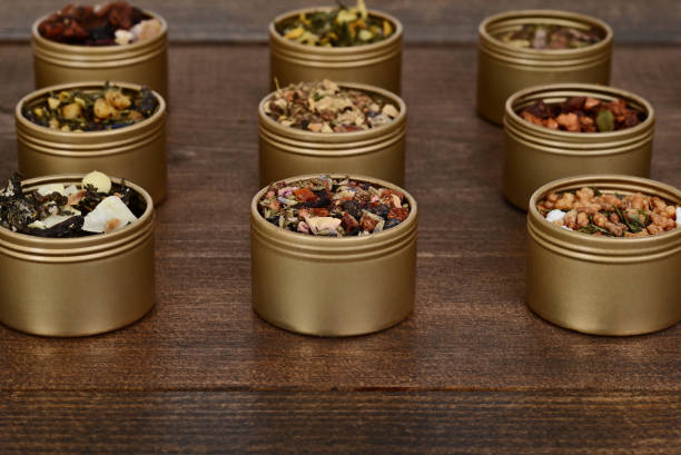 closeup assorted organic tea in metal tins